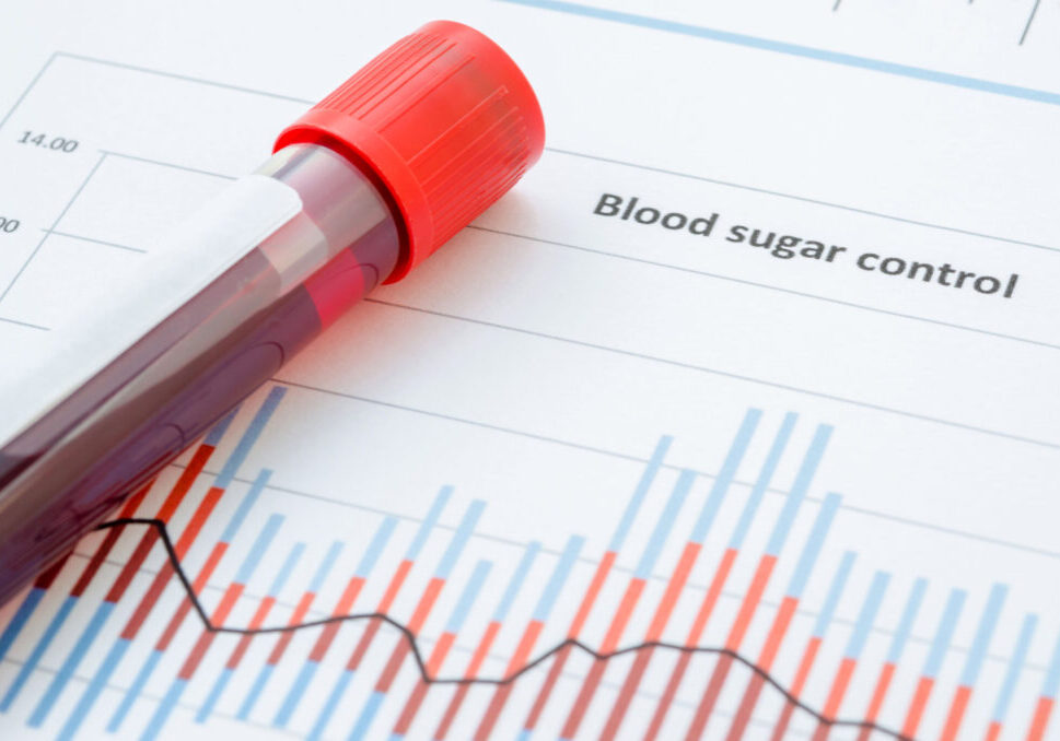 Sample blood for screening diabetic test in blood tube on blood sugar control chart.